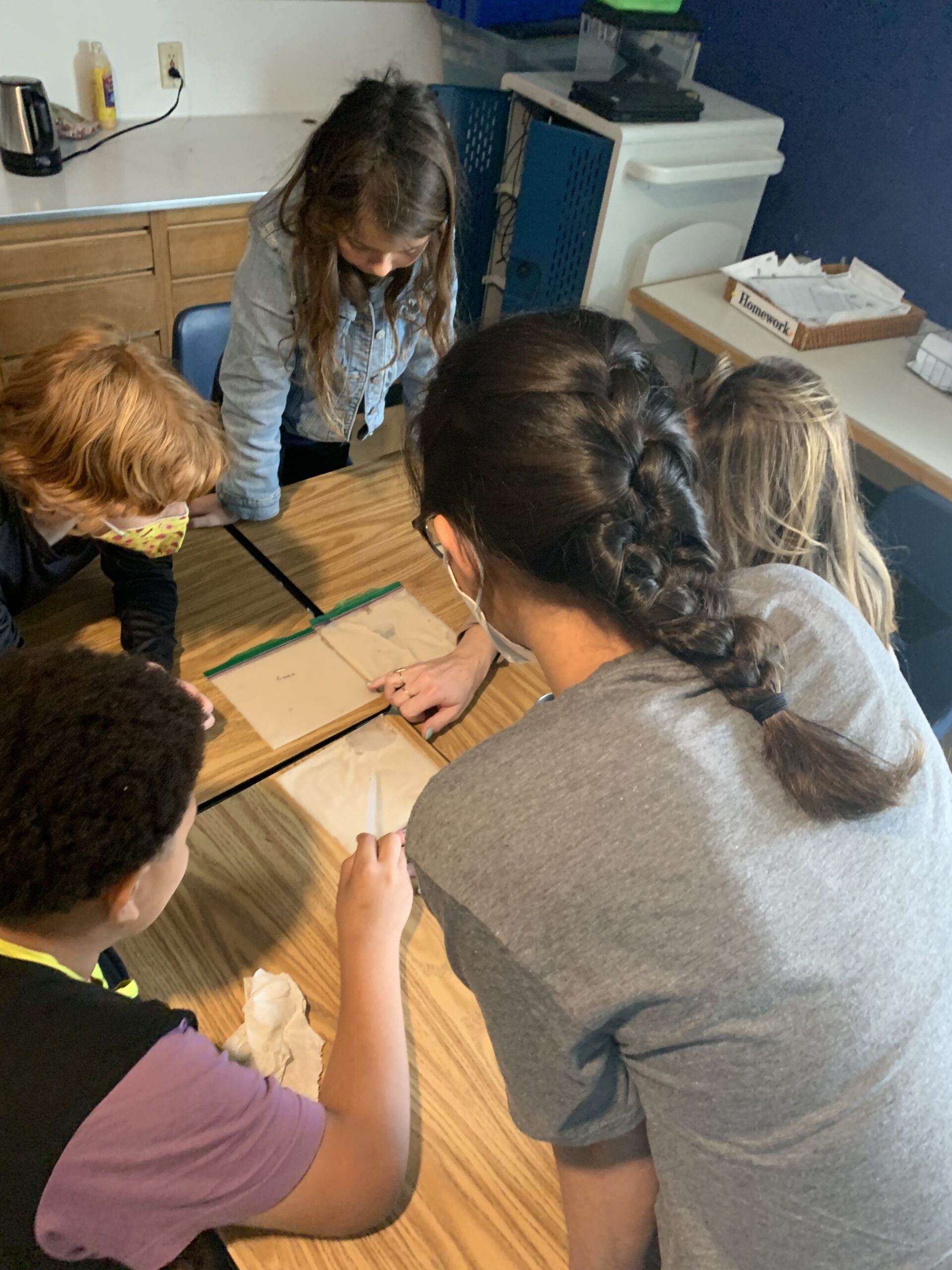 3 students comparing experiment